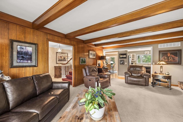 544 Maple Bluff Rd, Stevens Point, WI 54482 - carpeted living room featuring stairs, beam ceiling, and wooden walls