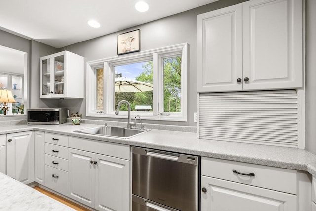 544 Maple Bluff Rd, Stevens Point, WI 54482 - kitchen with stainless steel appliances, glass insert cabinets, white cabinetry, light countertops, and recessed lighting