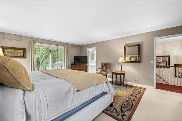 544 Maple Bluff Rd, Stevens Point, WI 54482 - carpeted bedroom featuring baseboards and access to exterior