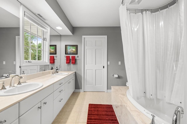 544 Maple Bluff Rd, Stevens Point, WI 54482 - bathroom with double vanity and tile patterned flooring