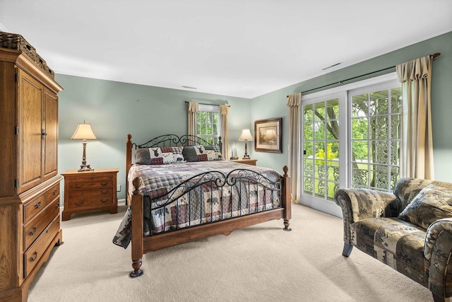 544 Maple Bluff Rd, Stevens Point, WI 54482 - bedroom with light colored carpet and access to exterior