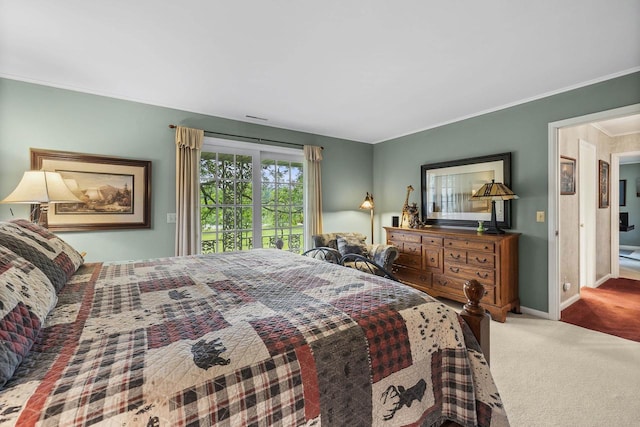 544 Maple Bluff Rd, Stevens Point, WI 54482 - carpeted bedroom featuring crown molding and access to exterior