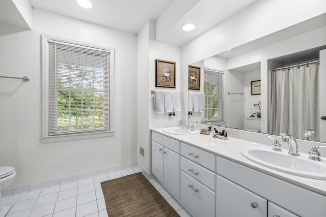 544 Maple Bluff Rd, Stevens Point, WI 54482 - full bathroom featuring plenty of natural light, double vanity, tile patterned flooring, and recessed lighting