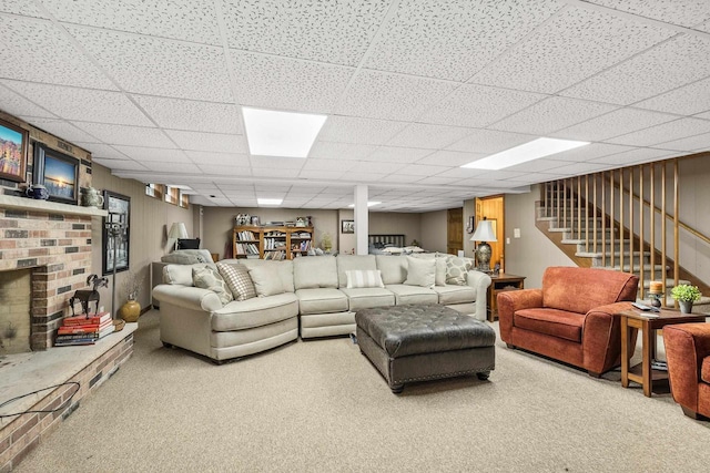 544 Maple Bluff Rd, Stevens Point, WI 54482 - carpeted living area featuring stairway, a drop ceiling, and a brick fireplace