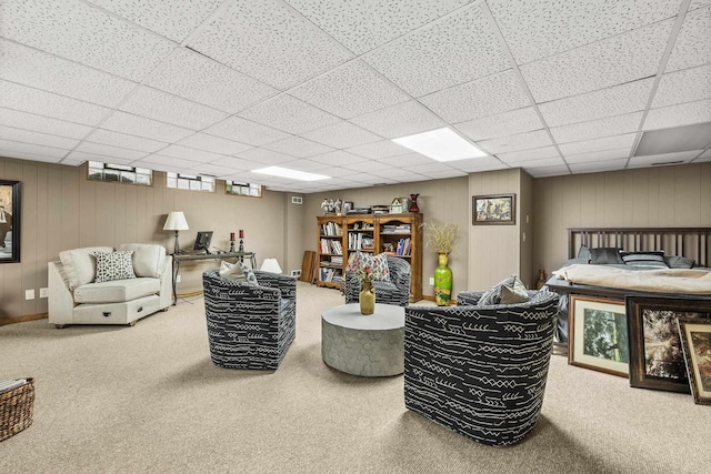 544 Maple Bluff Rd, Stevens Point, WI 54482 - carpeted living room featuring a drop ceiling and wooden walls
