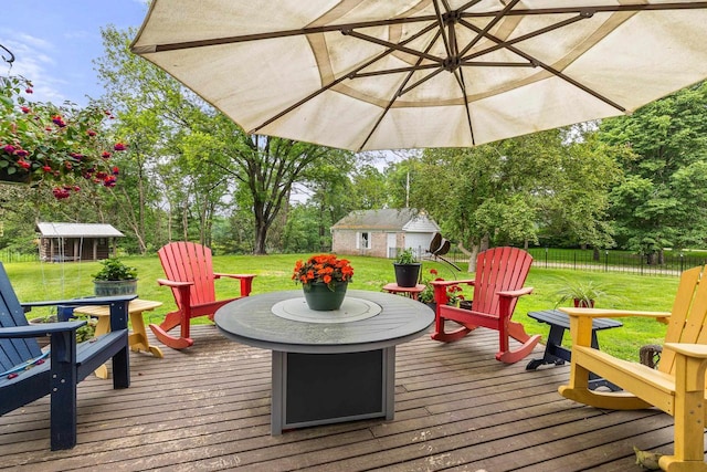 544 Maple Bluff Rd, Stevens Point, WI 54482 - wooden terrace with an outbuilding, a fire pit, and view of scattered trees