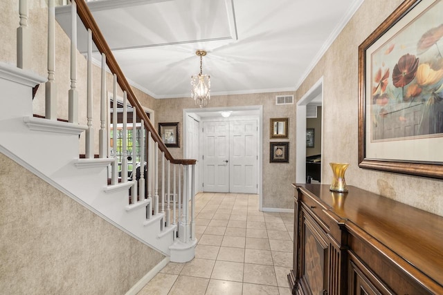 544 Maple Bluff Rd, Stevens Point, WI 54482 - foyer entrance featuring stairway, a chandelier, light tile patterned floors, and crown molding