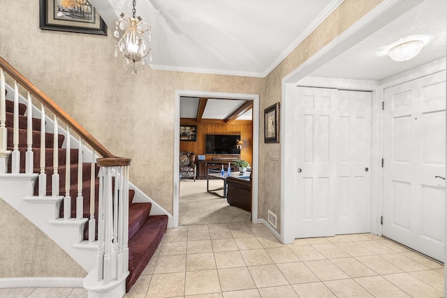 544 Maple Bluff Rd, Stevens Point, WI 54482 - entryway with stairway, light tile patterned flooring, and a chandelier