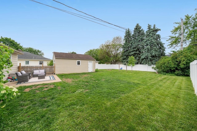 973 Grove St, Neenah, WI 54956 - fenced backyard with an outdoor hangout area, a patio, and an outbuilding