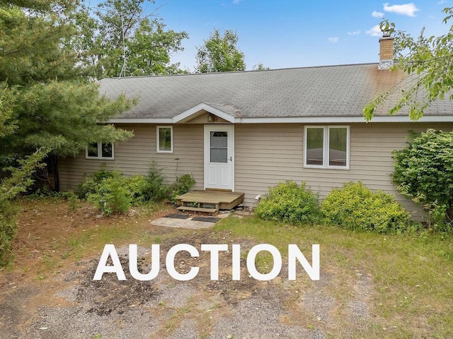N3045 Lakeview Dr, Montello, WI 53949 - ranch-style house with a chimney, uncovered parking, and roof with shingles