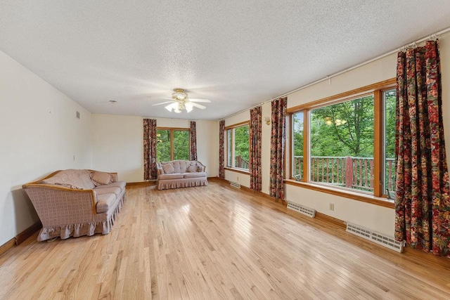 N3045 Lakeview Dr, Montello, WI 53949 - unfurnished room featuring a textured ceiling, wood finished floors, and ceiling fan
