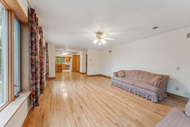 N3045 Lakeview Dr, Montello, WI 53949 - living room with ceiling fan, light wood-type flooring, and a textured ceiling