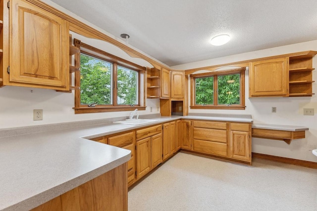 N3045 Lakeview Dr, Montello, WI 53949 - kitchen featuring open shelves, light countertops, plenty of natural light, and a textured ceiling