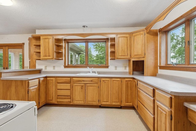 N3045 Lakeview Dr, Montello, WI 53949 - kitchen with open shelves, a textured ceiling, light countertops, a peninsula, and electric range