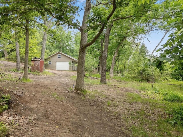N3045 Lakeview Dr, Montello, WI 53949 - view of yard with an outbuilding, a garage, and driveway