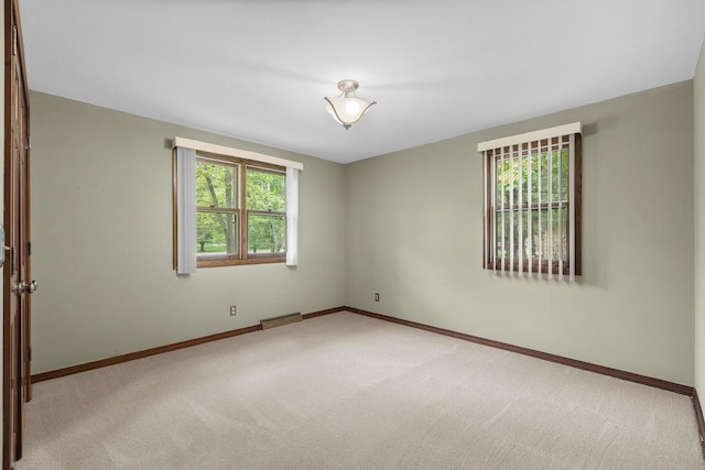 535 Maple Bluff Rd, Stevens Point, WI 54482 - empty room featuring carpet and baseboards