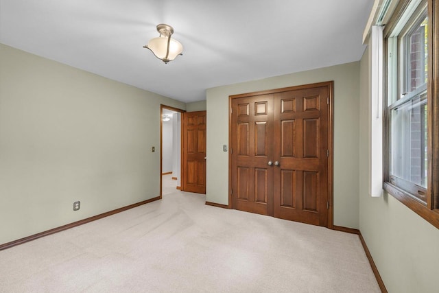535 Maple Bluff Rd, Stevens Point, WI 54482 - unfurnished bedroom featuring light carpet and a closet