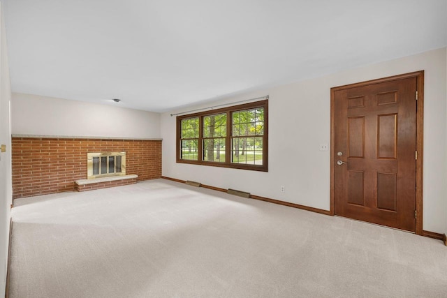 535 Maple Bluff Rd, Stevens Point, WI 54482 - unfurnished living room featuring carpet flooring and a brick fireplace