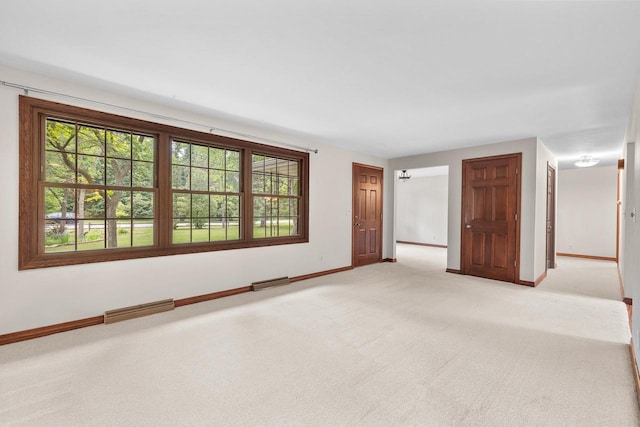 535 Maple Bluff Rd, Stevens Point, WI 54482 - unfurnished room with baseboards and light colored carpet