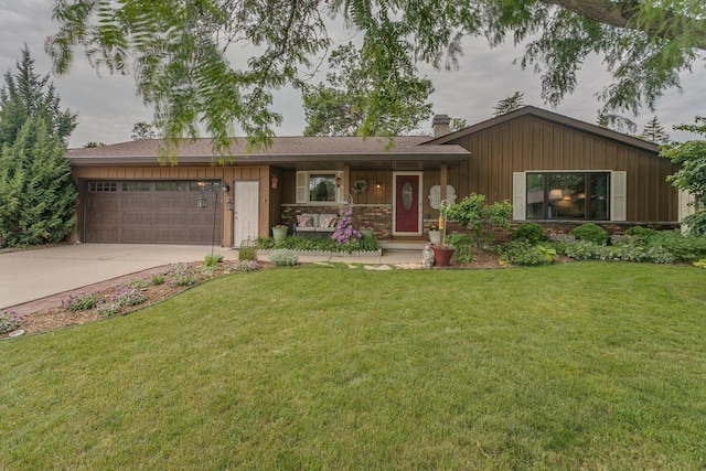 1801 N Mc Intosh Dr, Appleton, WI 54914 - view of front of home featuring an attached garage, driveway, a chimney, and a front lawn