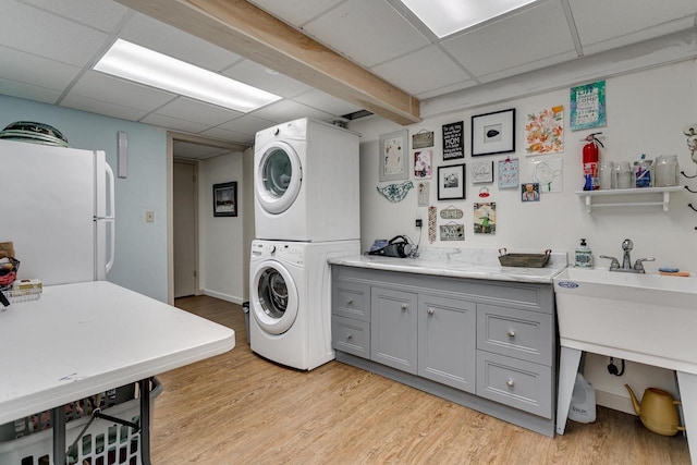 1801 N Mc Intosh Dr, Appleton, WI 54914 - laundry area with stacked washer / drying machine and light wood-style flooring