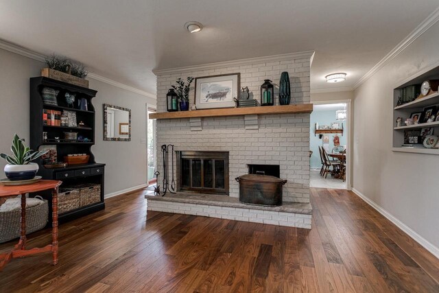 1801 N Mc Intosh Dr, Appleton, WI 54914 - living room featuring a brick fireplace, wood finished floors, and crown molding