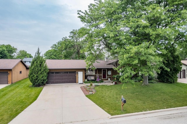 1801 N Mc Intosh Dr, Appleton, WI 54914 - view of front of property featuring a garage, driveway, a front yard, and a shingled roof