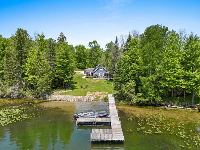 9071 Doemel Ln, Pickerel, WI 54465 - dock area featuring a water view, a forest view, and a lawn