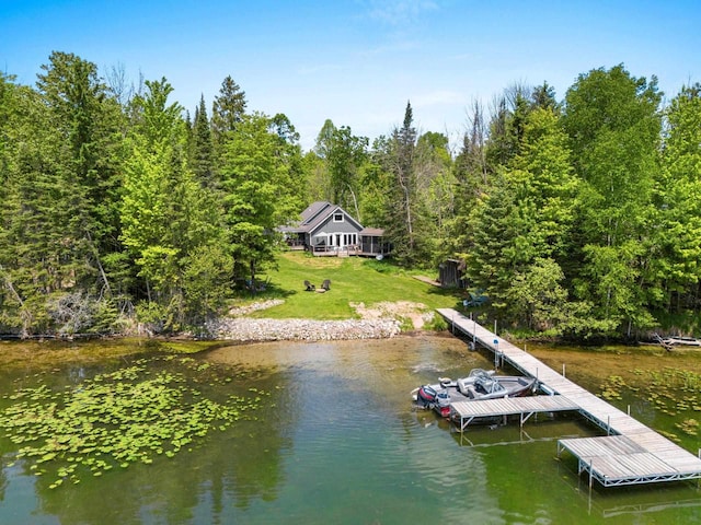 9071 Doemel Ln, Pickerel, WI 54465 - dock with a water view, a yard, and a view of trees