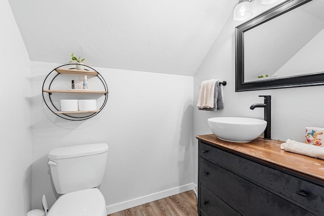 9071 Doemel Ln, Pickerel, WI 54465 - half bathroom with wood finished floors, vanity, and vaulted ceiling