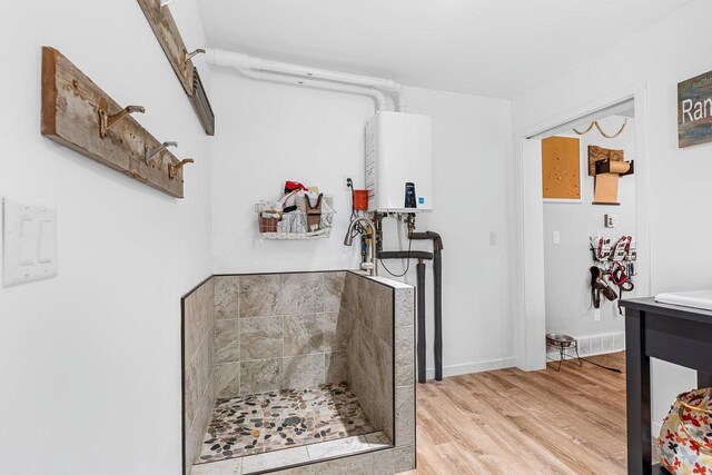 9071 Doemel Ln, Pickerel, WI 54465 - hall featuring tankless water heater and light wood finished floors