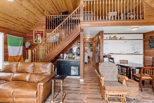 9071 Doemel Ln, Pickerel, WI 54465 - living area featuring wood walls, stairway, a bar, wood finished floors, and wood ceiling