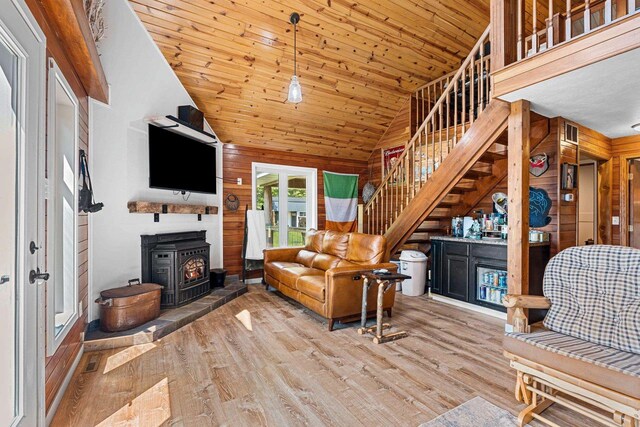 9071 Doemel Ln, Pickerel, WI 54465 - living room with lofted ceiling, wood finished floors, wood walls, stairs, and wooden ceiling