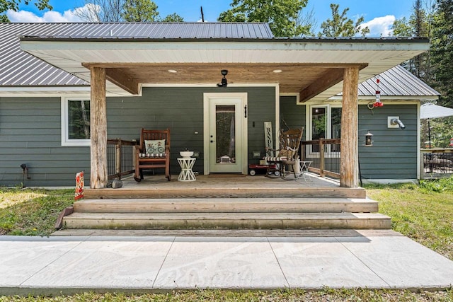 9071 Doemel Ln, Pickerel, WI 54465 - doorway to property with covered porch and a metal roof
