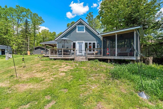 9071 Doemel Ln, Pickerel, WI 54465 - back of property with a yard, a sunroom, and a deck