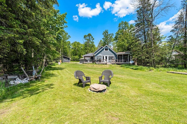 9071 Doemel Ln, Pickerel, WI 54465 - view of grassy yard featuring a deck, a sunroom, and view of scattered trees