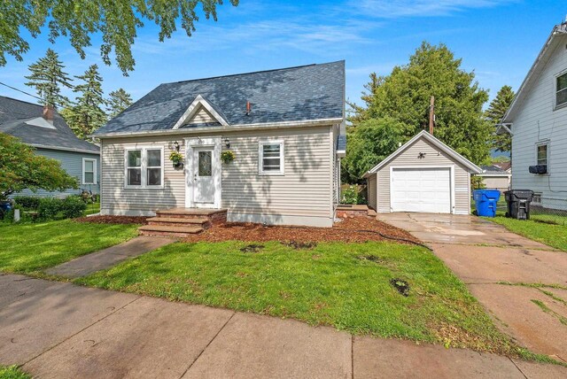 210 S Summit St, Appleton, WI 54914 - view of front of home featuring concrete driveway, an outdoor structure, a front yard, and a garage
