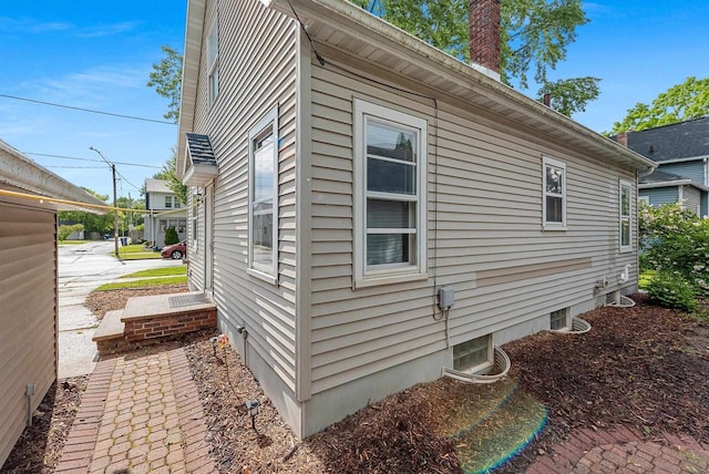 210 S Summit St, Appleton, WI 54914 - view of home's exterior with a chimney