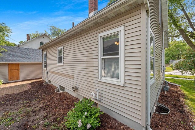 210 S Summit St, Appleton, WI 54914 - view of side of property featuring a chimney and an outdoor structure