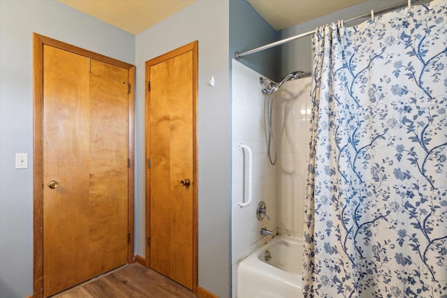 197 Juniper Ave, Brodhead, WI 53520 - full bathroom featuring shower / bath combo and wood finished floors