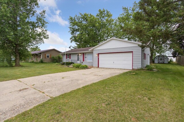 197 Juniper Ave, Brodhead, WI 53520 - ranch-style house with a storage shed, an attached garage, a front lawn, and driveway