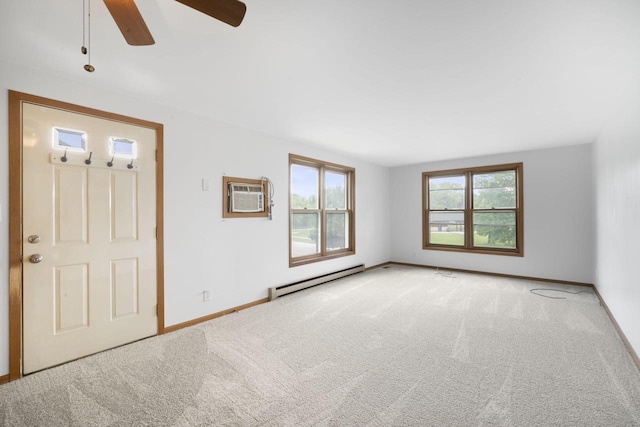 2560 Pebble Valley Rd, Waukesha, WI 53188 - carpeted spare room with a baseboard heating unit, an AC wall unit, and ceiling fan