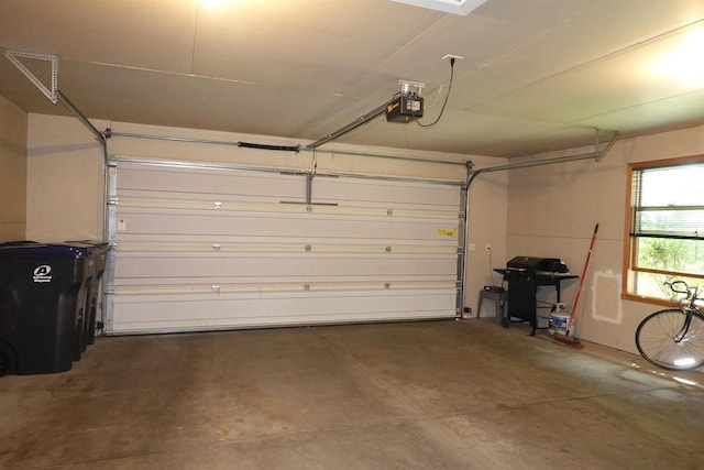 284 White Oak Ave Unit 8, Plover, WI 54467 - garage featuring a garage door opener