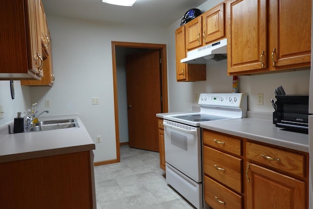 284 White Oak Ave Unit 8, Plover, WI 54467 - kitchen with electric stove, under cabinet range hood, brown cabinets, light countertops, and light floors