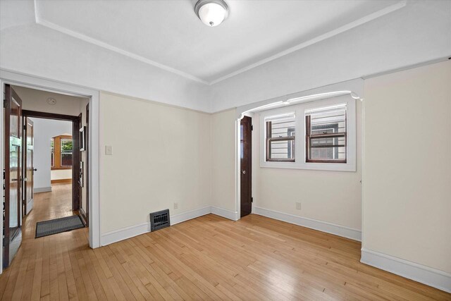 2767 S Herman St, Milwaukee, WI 53207 - spare room featuring light wood-style flooring and arched walkways