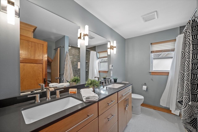 2767 S Herman St, Milwaukee, WI 53207 - full bathroom featuring plenty of natural light, double vanity, and curtained shower