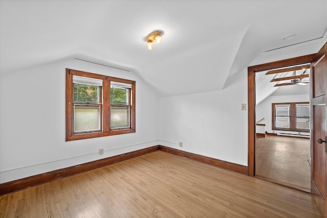 2767 S Herman St, Milwaukee, WI 53207 - additional living space featuring lofted ceiling, light wood finished floors, ceiling fan, and a baseboard radiator