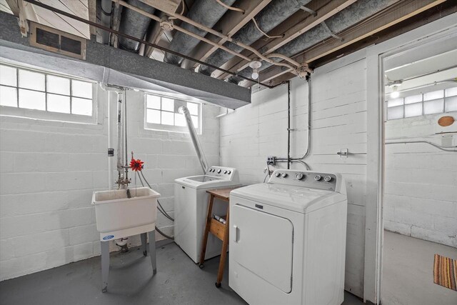 2767 S Herman St, Milwaukee, WI 53207 - laundry area with washer and dryer and concrete block wall