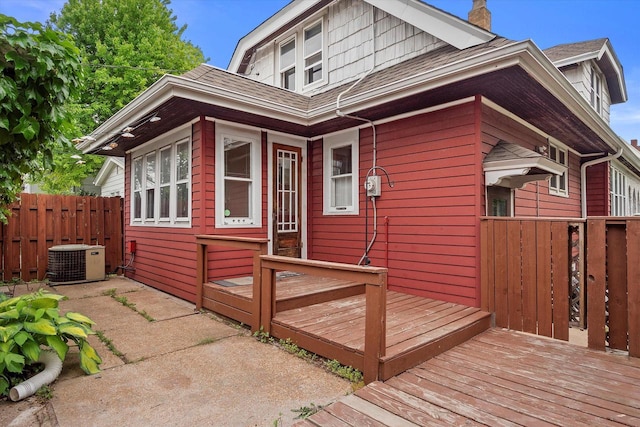 2767 S Herman St, Milwaukee, WI 53207 - view of front of home featuring a wooden deck, a shingled roof, and a chimney