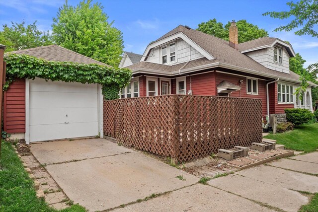 2767 S Herman St, Milwaukee, WI 53207 - view of front of property with a chimney, driveway, and roof with shingles